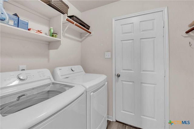 7810 Woodbury Dr, Temple, TX 76502 - laundry area with independent washer and dryer and wood finished floors