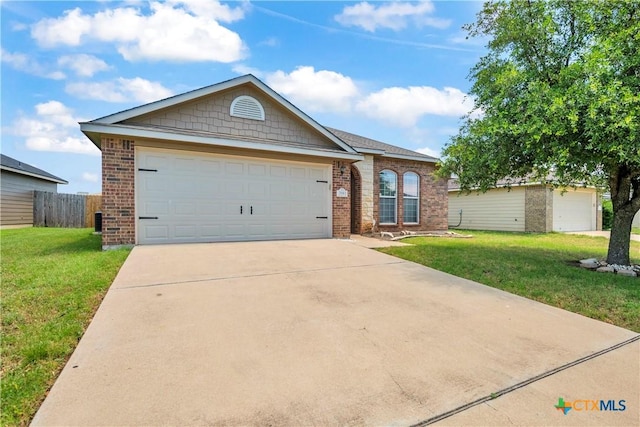 7810 Woodbury Dr, Temple, TX 76502 - ranch-style home featuring brick siding, concrete driveway, and a garage