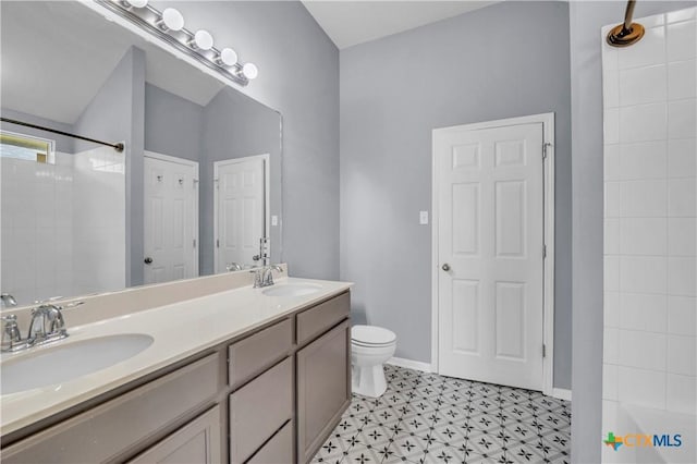 7810 Woodbury Dr, Temple, TX 76502 - full bathroom featuring double vanity, a shower, toilet, baseboards, and tile patterned floors