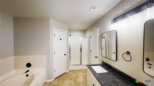 403 Ali Dr, Killeen, TX 76542 - full bathroom with a shower stall, a bath, vanity, and baseboards