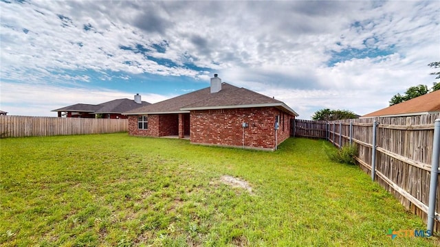 403 Ali Dr, Killeen, TX 76542 - back of house with brick siding and a chimney