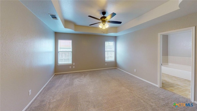 403 Ali Dr, Killeen, TX 76542 - carpeted spare room with a ceiling fan, plenty of natural light, baseboards, and a raised ceiling
