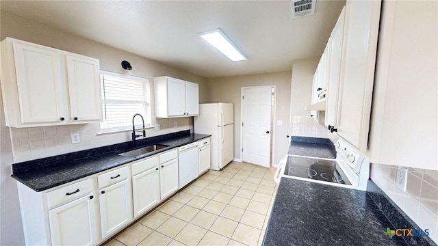 403 Ali Dr, Killeen, TX 76542 - kitchen with a sink, white appliances, decorative backsplash, white cabinetry, and light tile patterned flooring