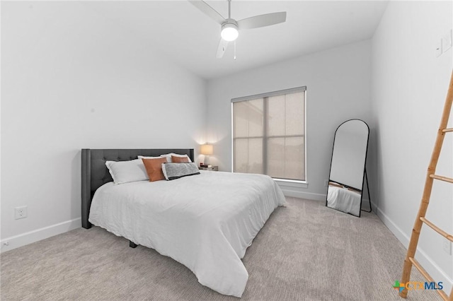 bedroom with light colored carpet and ceiling fan