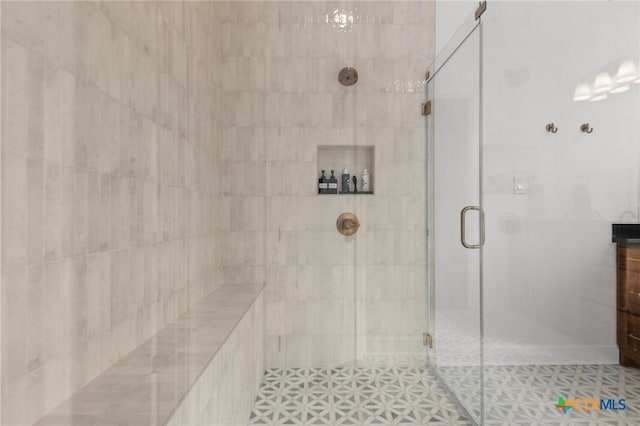 bathroom featuring an enclosed shower