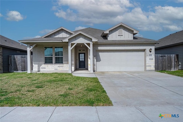 single story home featuring concrete driveway, board and batten siding, fence, a garage, and a front lawn