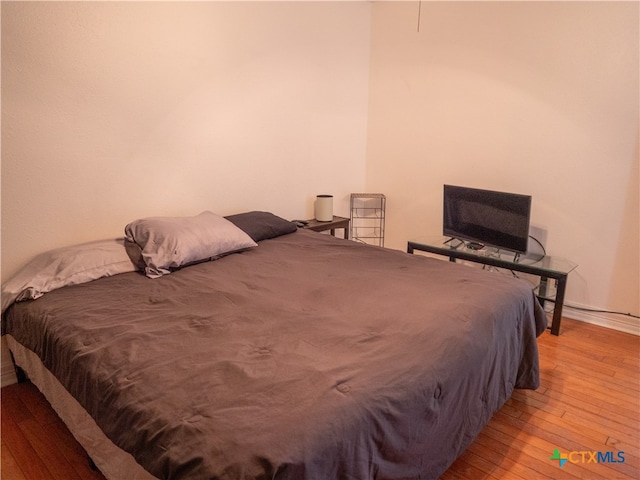 bedroom with light wood-type flooring