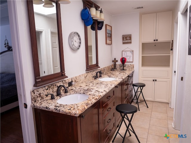 bathroom with vanity and tile patterned floors