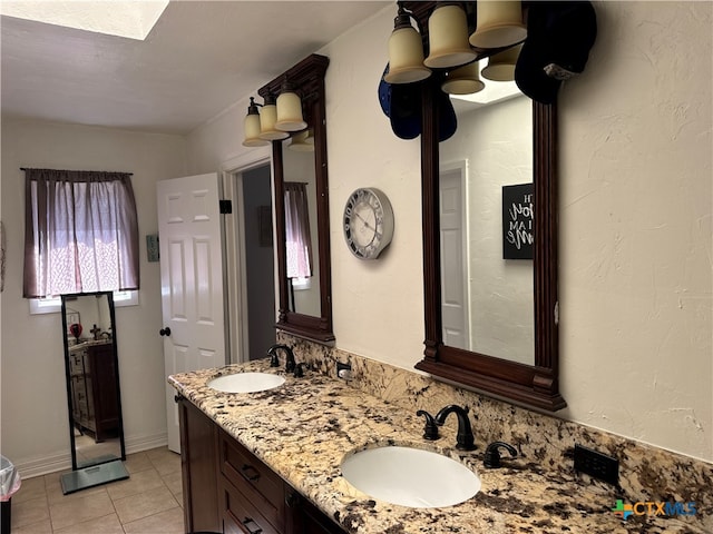 bathroom featuring vanity, a textured ceiling, and tile patterned flooring