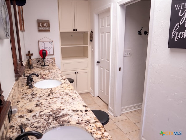 bathroom featuring vanity and tile patterned flooring