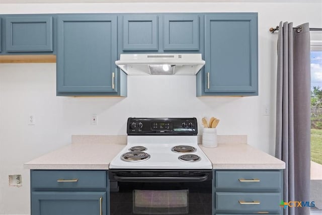 606 Aikman Dr, Troy, TX 76579 - kitchen with range with electric stovetop, under cabinet range hood, blue cabinets, and light countertops