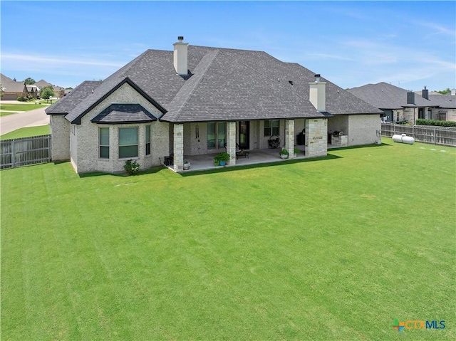 813 Reston Rd, Temple, TX 76502 - back of house featuring a chimney, a fenced backyard, and a shingled roof