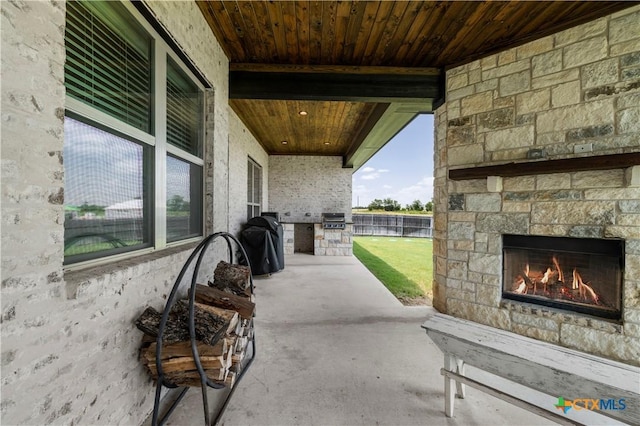 813 Reston Rd, Temple, TX 76502 - view of patio / terrace featuring an outdoor stone fireplace and an outdoor kitchen
