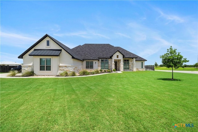813 Reston Rd, Temple, TX 76502 - view of front of home featuring stone siding, a standing seam roof, stucco siding, and a metal roof