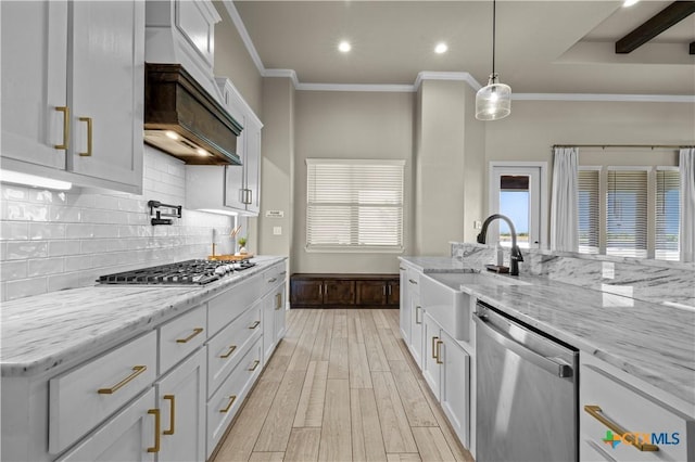 813 Reston Rd, Temple, TX 76502 - kitchen featuring appliances with stainless steel finishes, light wood finished floors, decorative backsplash, ornamental molding, and white cabinets