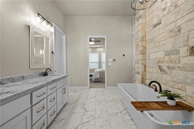 813 Reston Rd, Temple, TX 76502 - full bath featuring a soaking tub, vanity, ceiling fan, connected bathroom, and marble look tile flooring