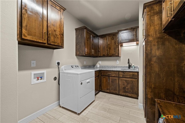 813 Reston Rd, Temple, TX 76502 - washroom featuring washer / clothes dryer, cabinet space, and wood finish floors