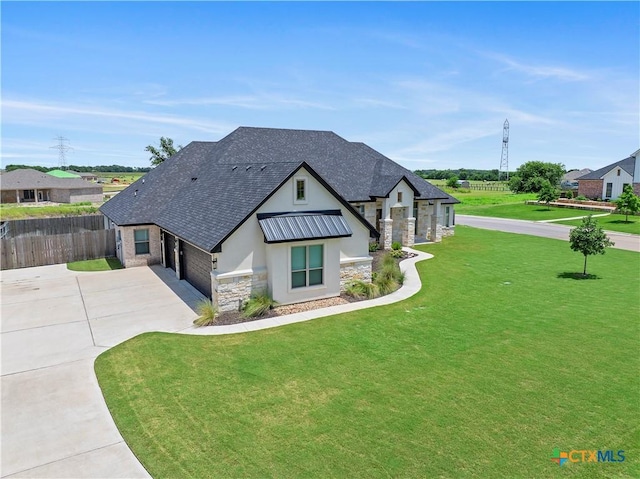 813 Reston Rd, Temple, TX 76502 - view of front of home with stone siding, concrete driveway, stucco siding, roof with shingles, and an attached garage