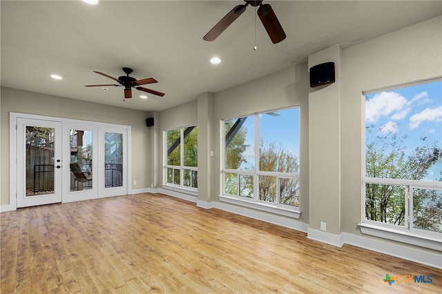 interior space featuring ceiling fan and french doors