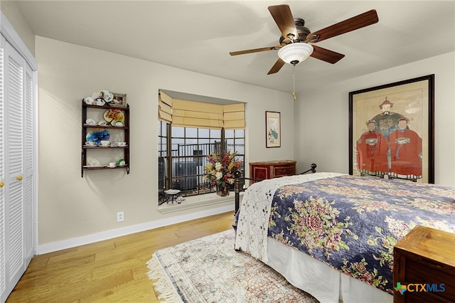 bedroom featuring hardwood / wood-style floors and ceiling fan