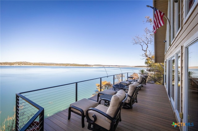 deck featuring a water view