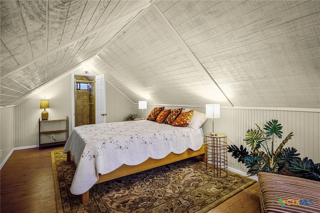 bedroom featuring lofted ceiling and hardwood / wood-style floors