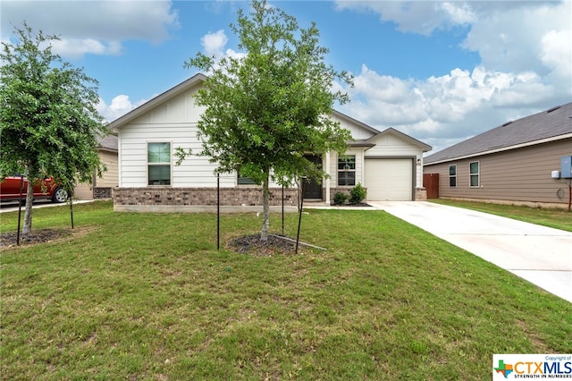 view of front facade with a front yard and a garage