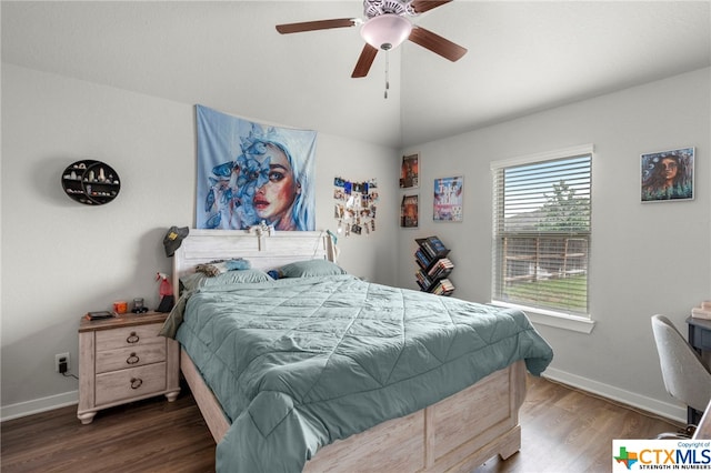 bedroom featuring ceiling fan and dark hardwood / wood-style floors