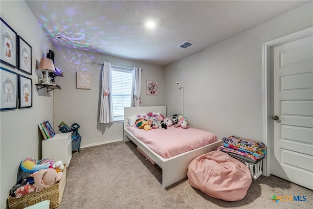 bedroom with light carpet