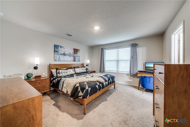 bedroom with light colored carpet