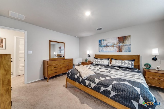 bedroom with light colored carpet