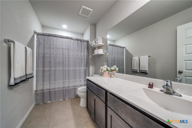 full bathroom featuring shower / tub combo with curtain, vanity, toilet, and tile patterned flooring