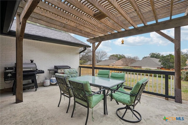 view of patio / terrace with a grill and a pergola