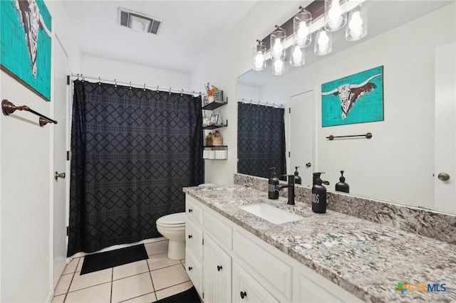 bathroom featuring vanity, a shower with curtain, tile patterned floors, and toilet