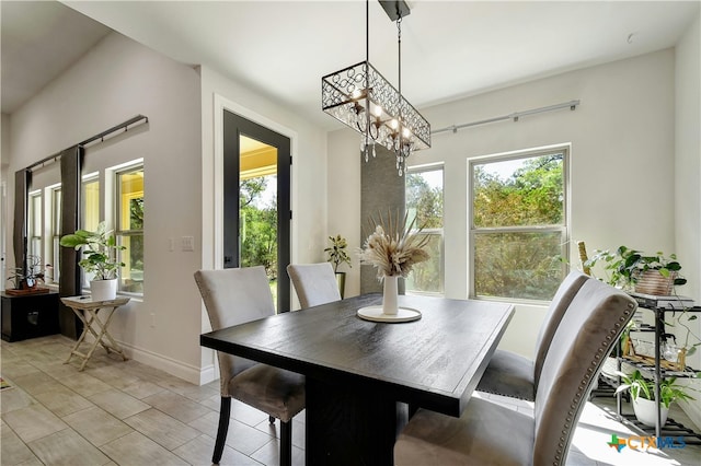 dining area featuring a notable chandelier