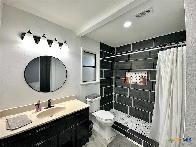 209 Roanoke Dr, Victoria, TX 77904 - bathroom featuring a tile shower and vanity