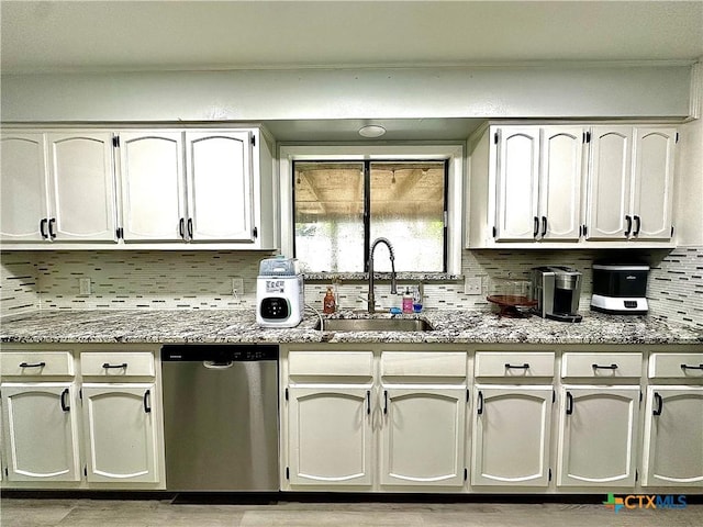 209 Roanoke Dr, Victoria, TX 77904 - kitchen with stainless steel dishwasher, decorative backsplash, and stone counters
