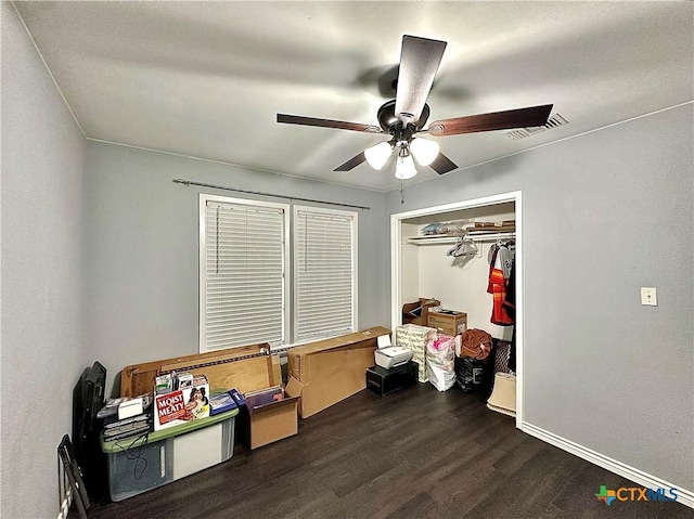 209 Roanoke Dr, Victoria, TX 77904 - bedroom with dark wood-style flooring, a ceiling fan, and a closet