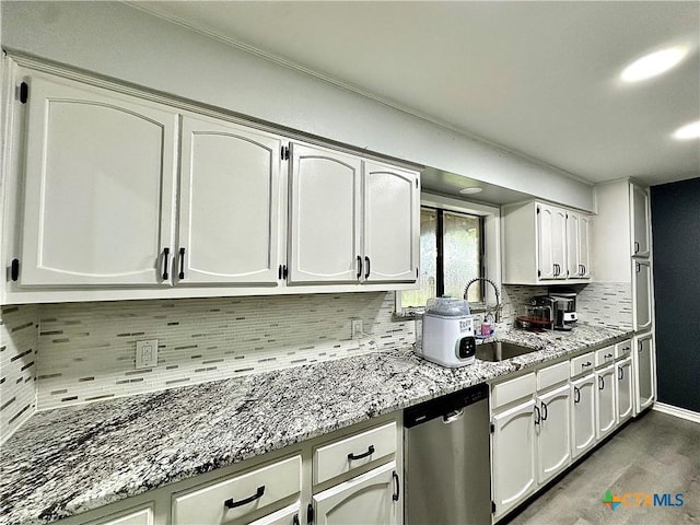 209 Roanoke Dr, Victoria, TX 77904 - kitchen featuring dishwasher, backsplash, light stone counters, and white cabinets