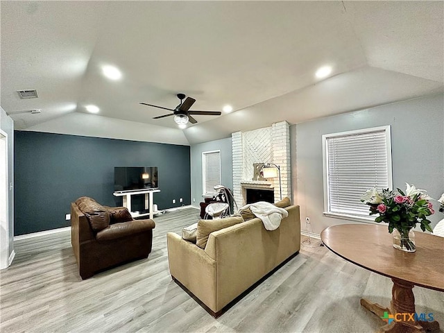 209 Roanoke Dr, Victoria, TX 77904 - living room featuring lofted ceiling, light wood-style flooring, a fireplace, and a ceiling fan