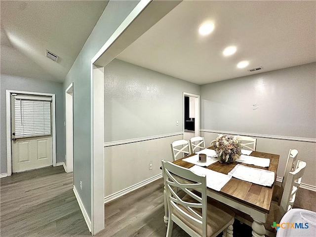 209 Roanoke Dr, Victoria, TX 77904 - dining area featuring wood finished floors and vaulted ceiling