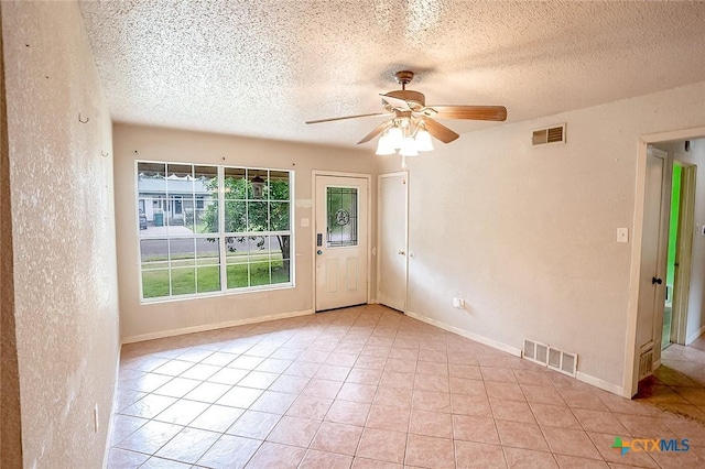 117 N 28th St, Gatesville, TX 76528 - unfurnished room with a ceiling fan, a textured ceiling, and light tile patterned flooring