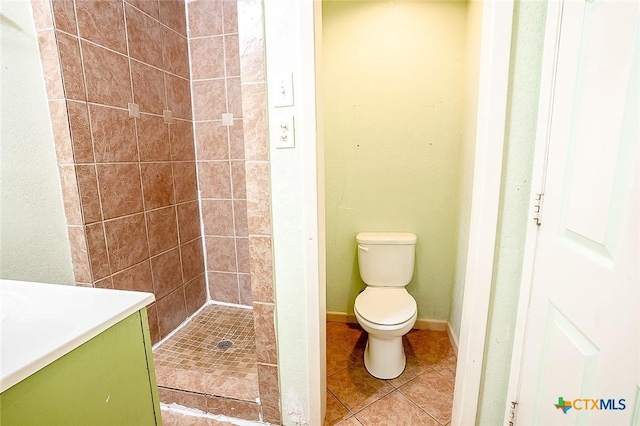 117 N 28th St, Gatesville, TX 76528 - full bathroom with a shower stall, toilet, tile patterned flooring, and vanity