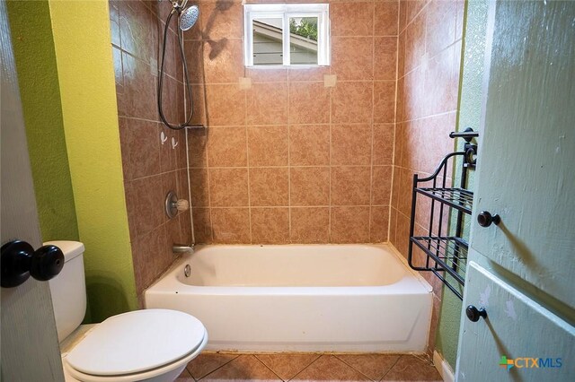 117 N 28th St, Gatesville, TX 76528 - bathroom with toilet,  shower combination, tile patterned floors, and a textured wall