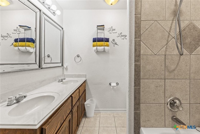 709 Aries Ave, Killeen, TX 76542 - full bath with double vanity, tile patterned flooring, washtub / shower combination, and baseboards