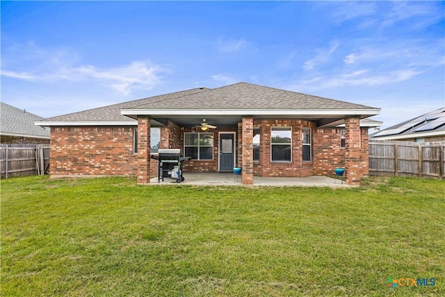 709 Aries Ave, Killeen, TX 76542 - back of house featuring brick siding, a patio, and a shingled roof