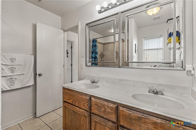 709 Aries Ave, Killeen, TX 76542 - full bathroom featuring double vanity, tile patterned floors, and curtained shower