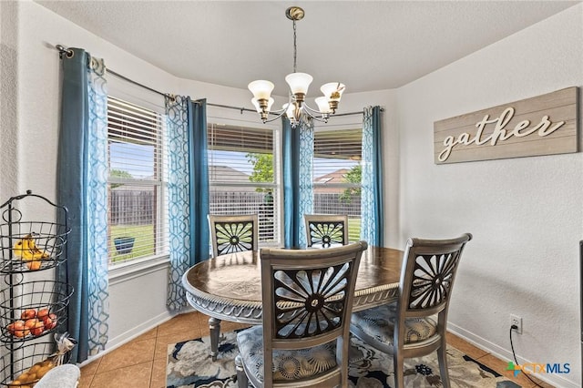 709 Aries Ave, Killeen, TX 76542 - dining room with a chandelier, baseboards, and light tile patterned floors
