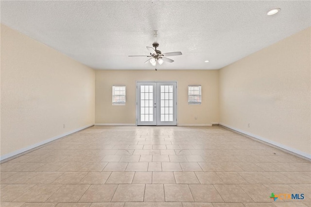 709 Aries Ave, Killeen, TX 76542 - spare room featuring ceiling fan, baseboards, a textured ceiling, french doors, and recessed lighting