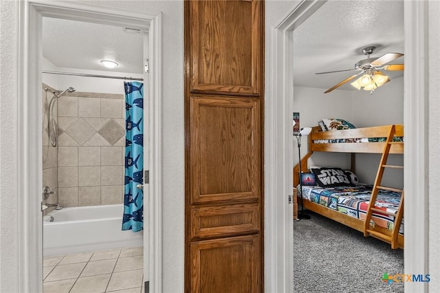 709 Aries Ave, Killeen, TX 76542 - bedroom featuring a textured ceiling, light tile patterned floors, and ceiling fan